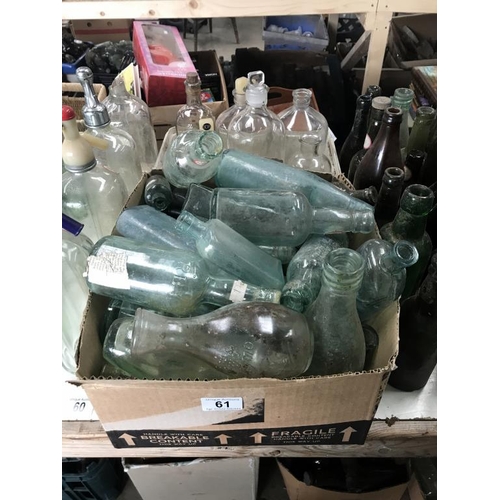 61 - A large box of 'local' clear bottles 7 a tub of 'chemists' type bottles