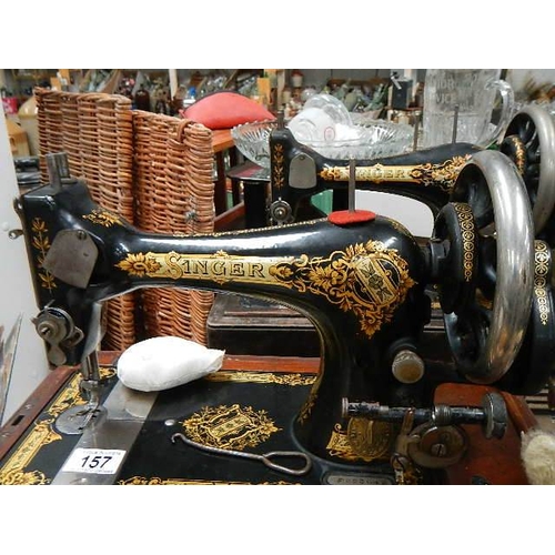 157 - Two vintage Singer sewing machines.