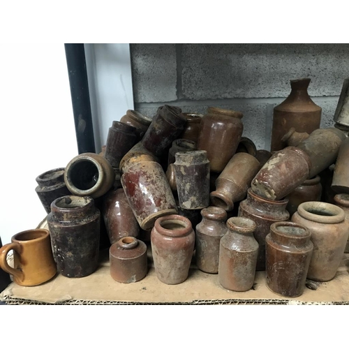 78 - A shelf of brown/white stoneware