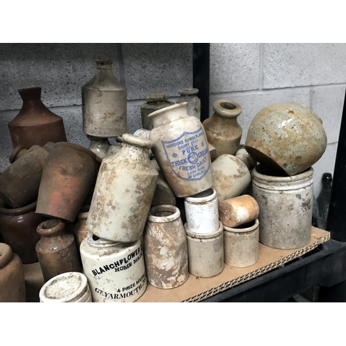 78 - A shelf of brown/white stoneware