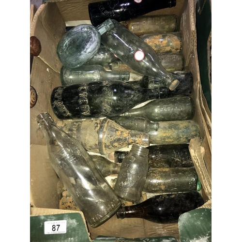 87 - A box of named bottles