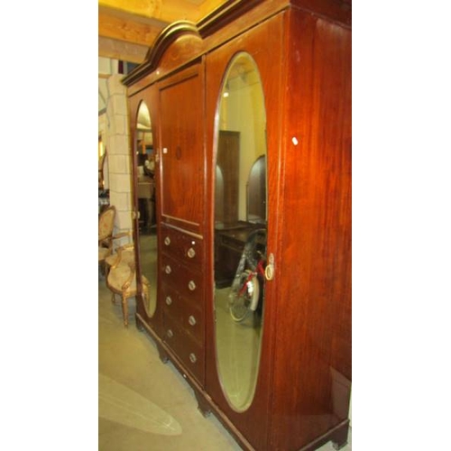 2685 - A mahogany inlaid combination wardrobe.