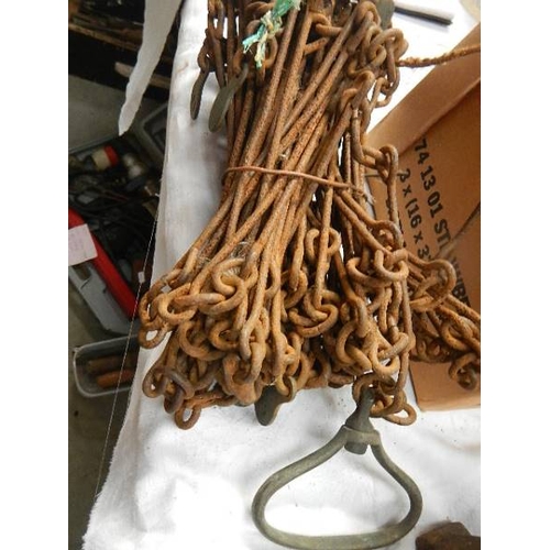 107 - Two sets of old surveyor's chains.