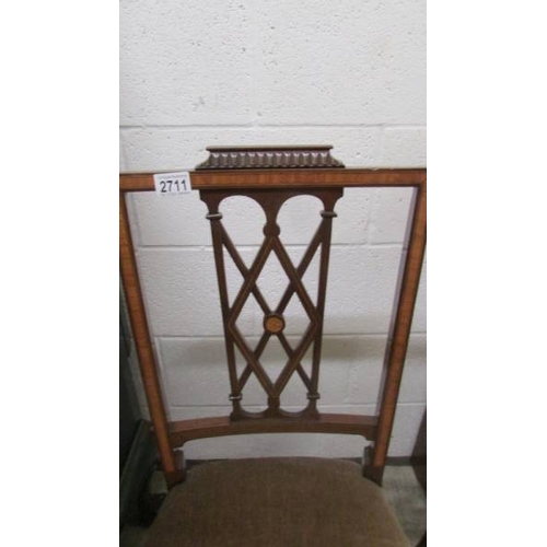2711 - A pair of mahogany inlaid chairs.