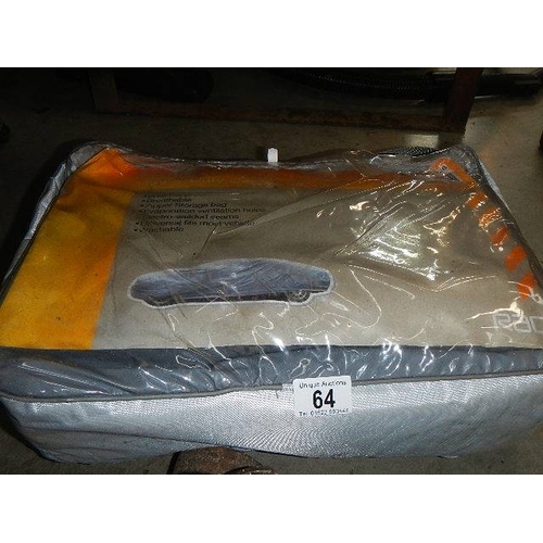 64 - An old car jack and a car blanket.