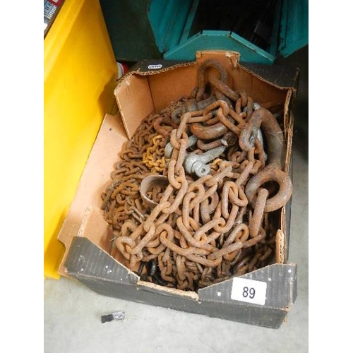 89 - A box of old metal chains.