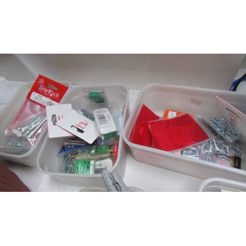 102 - Six tubs of nails, wall anchor sets etc.,