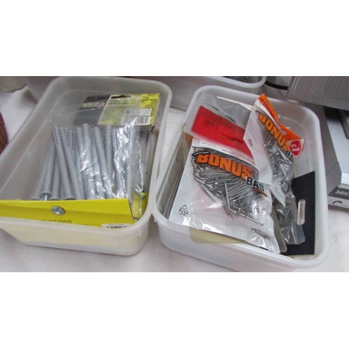 102 - Six tubs of nails, wall anchor sets etc.,