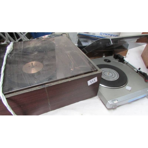 111 - A Dual 1210 turntable, a Bush acoustics turntable and a cassette case. (Collect only)