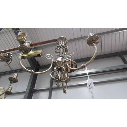 123 - Two electric chandeliers and a wall light. (Collect only)