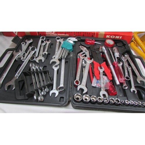 140 - A mixed lot of spanners, motoring books etc.,