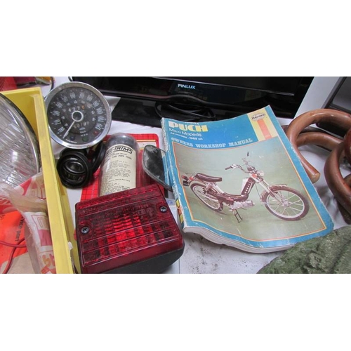 148 - A mixed lot of motoring items including speedometer, lights, battery charger etc., (Collect only)