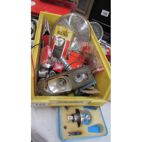 148 - A mixed lot of motoring items including speedometer, lights, battery charger etc., (Collect only)