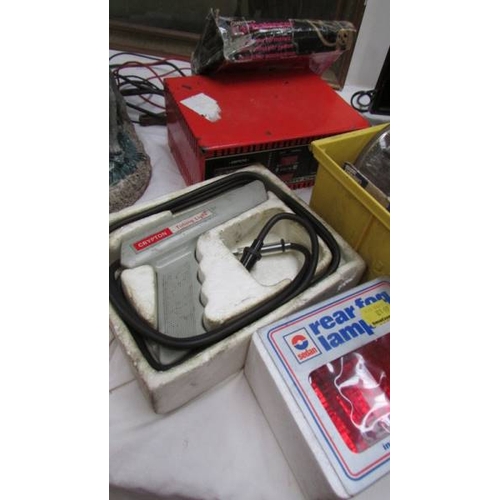 148 - A mixed lot of motoring items including speedometer, lights, battery charger etc., (Collect only)