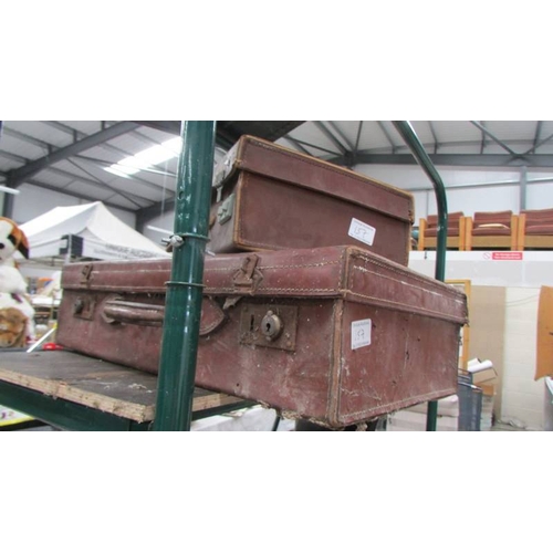 157 - An old cabin trunk and two leather suitcases. (Collect only)