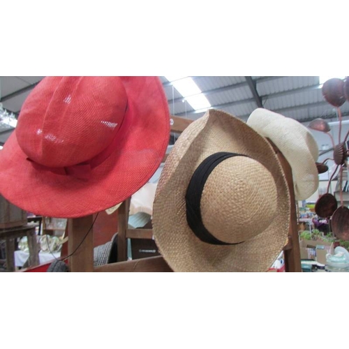 176 - A collection of vintage hats and a wooden clothes horse. (Collect only)