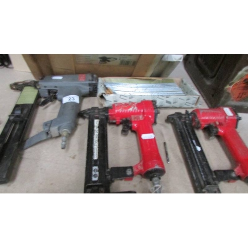 23 - A good lot of air tools including 'DA', air driver, 3 staple/nail guns etc.,