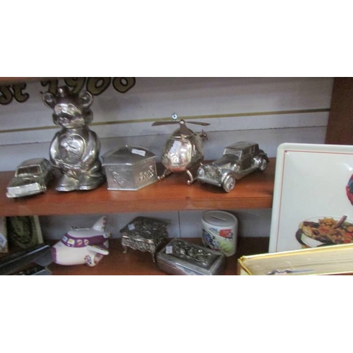 235 - A mixed lot of vintage toys, money boxes etc.,