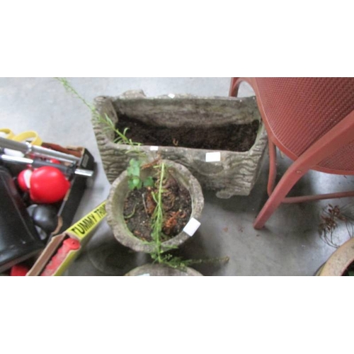 319 - Two planters and 4 circular garden slabs. (Collect only)