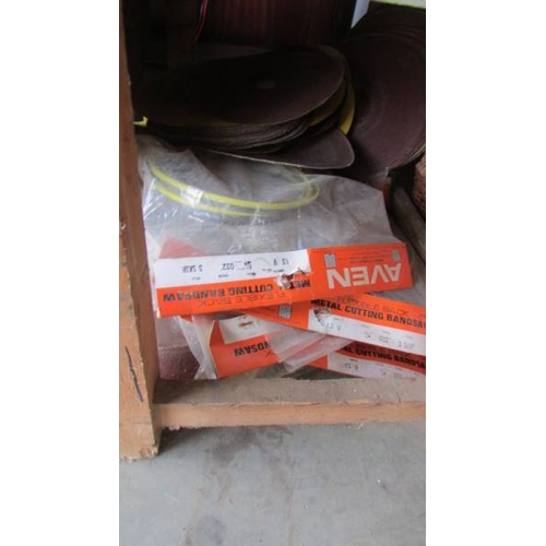 336 - A bench bandsaw on bench with spare bands etc., (Collect only)