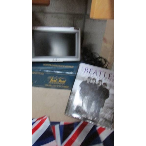37 - A VE Day 75 hard back book, The 'Unseen Archives' Beatle book, a Trivial Pursuit and a portable colo... 