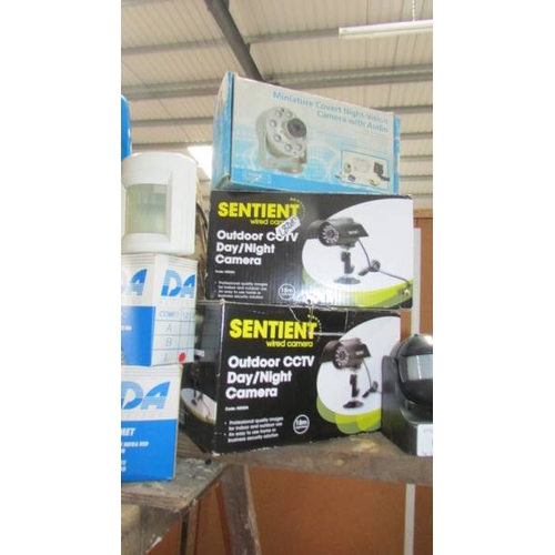 62 - A Covert night vision camera, 2 boxed Sentient outdoor CCTV day/night camera kits and a box of infra... 