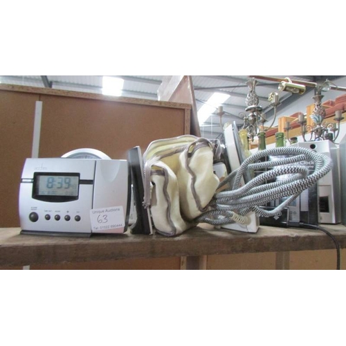 63 - A mixed lot including clocks, walkie talkie, speakers etc.,