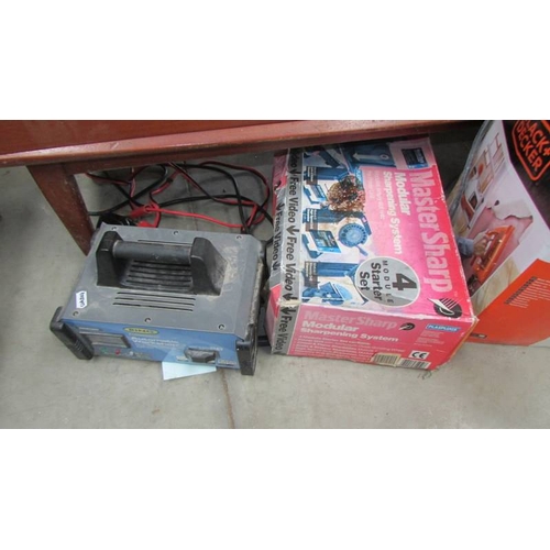 84 - A Black & Decker wall paper stripper, sharpening system etc.,