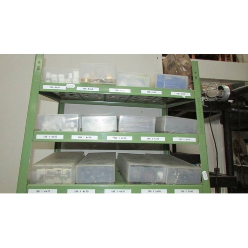 95 - A green metal shelf unit with 40 boxes of assorted screws, nails etc., (Collect only)