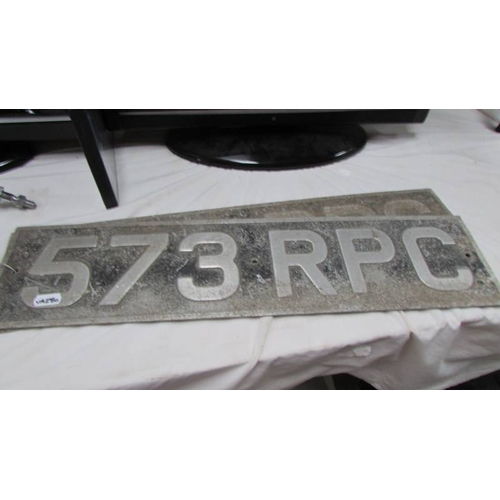 98 - A pair of old car number plates, wing mirrors, oil can etc.,