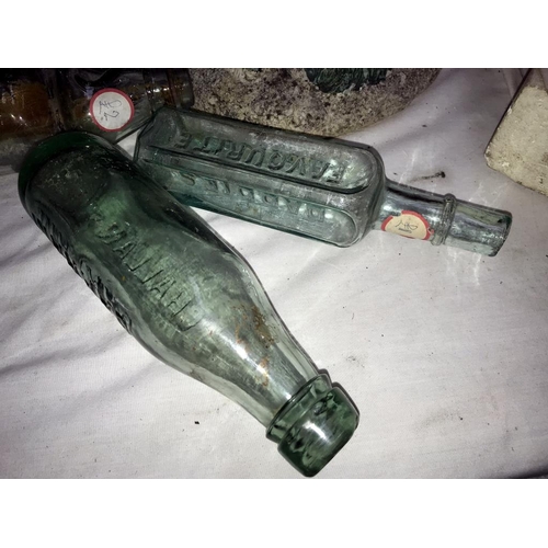 151 - A mixed lot of old bottles.