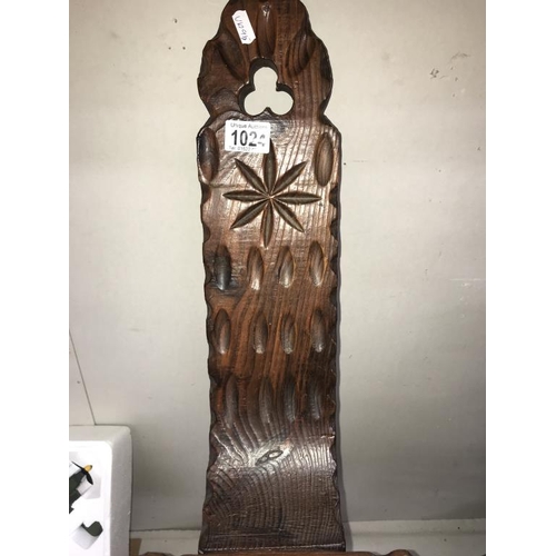 1024 - A carved dark wood spinning chair.  (Collect only)