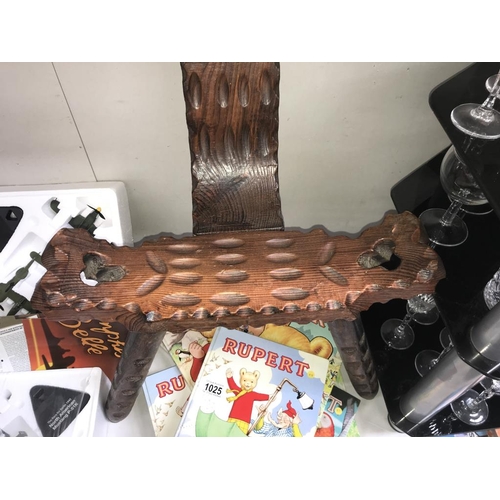 1024 - A carved dark wood spinning chair.  (Collect only)