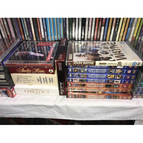 1033 - A large quantity of CD's including quantity of compilation film DVD's