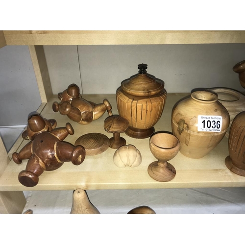 1036 - A large quantity of carved/turned wooden items including mushrooms, Teddy Bears & fruit etc.