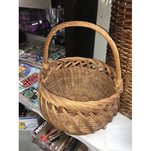 1042 - A wicker linen basket, shopping basket & 2 others.  (Collect only)