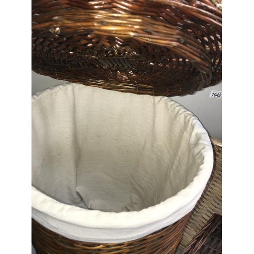 1042 - A wicker linen basket, shopping basket & 2 others.  (Collect only)