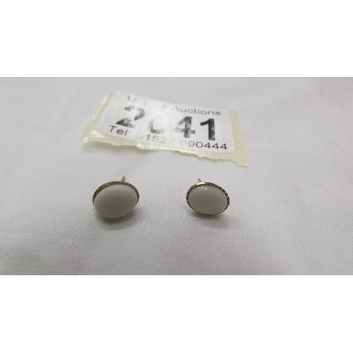 2041 - A pair of 9ct gold earrings set natural opals.