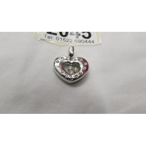 2045 - A white gold floating diamond heart pendant.