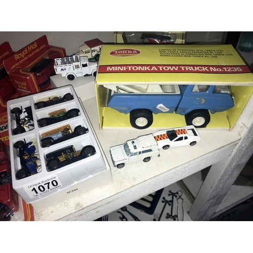 1070 - A boxed tonka mini Tonka tow truck & a quantity of unboxed die cast cars etc.