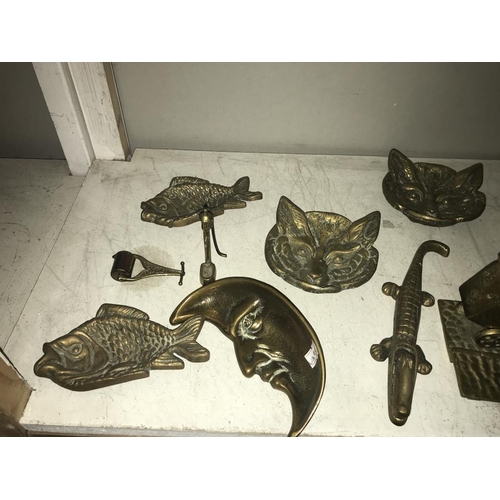 1084 - A selection of brassware including cat head, dishes & crocodile nut cracker etc.