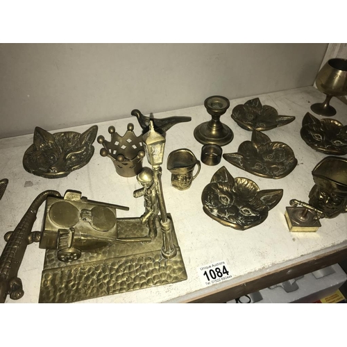 1084 - A selection of brassware including cat head, dishes & crocodile nut cracker etc.