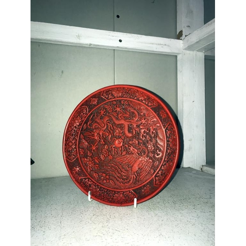 1109 - A Cinnabar plate, a pot featuring dragon design & a statue of a Buddha (small chip to hand)