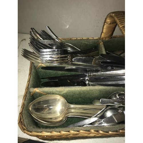 1120 - A wicker cutlery tray & selection of flat ware