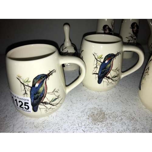 1125 - A quantity of Brixham pottery bird decorated pottery including 4 mugs, salt & pepper & vinegar & bel... 