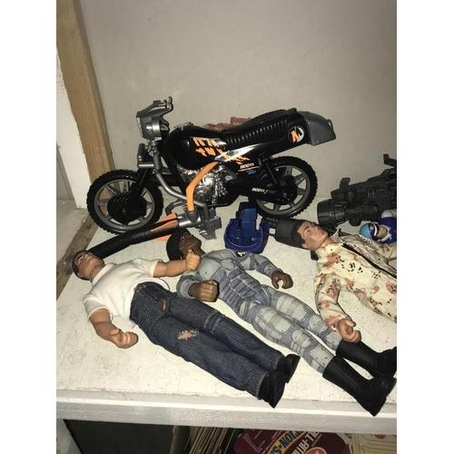 1128 - A quantity of Action Man Doll's etc.