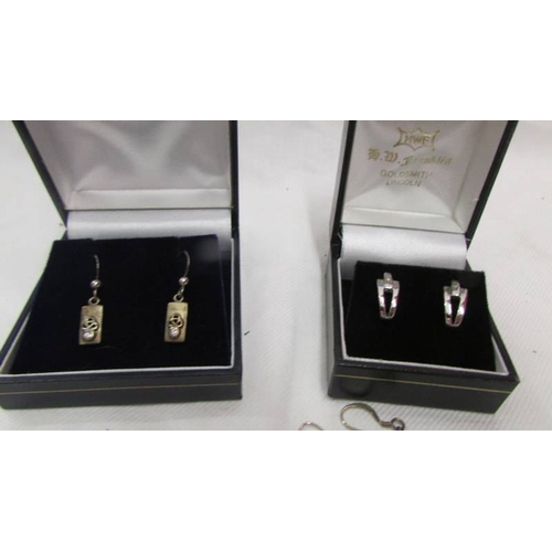 2001 - Two pairs of silver earrings and six other pairs of earrings.