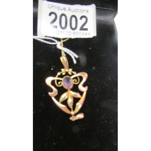 2002 - A pretty 9ct gold art nouveau pendant on a 9ct gold chain.