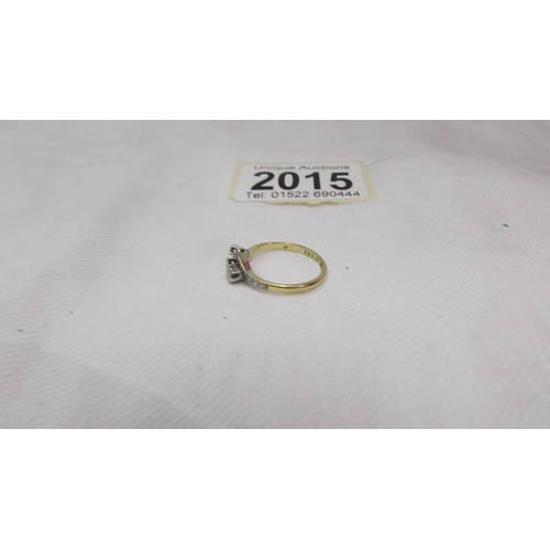 2015 - A circa 1940 diamond ring in a three stone design, platinum set, 18ct gold shank, stamped 18ct/Plat.... 