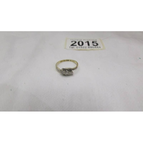 2015 - A circa 1940 diamond ring in a three stone design, platinum set, 18ct gold shank, stamped 18ct/Plat.... 